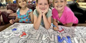 Summer is underway at the boys & girls clubs of central and northern new hampshire. This is a picture of girls smiling while working on an art project and having fun at summer camp.